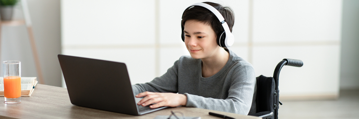 Boy completing online assessment Boy completing online assessment